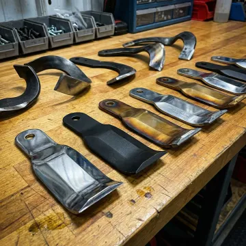 Close-up of agricultural flail and tiller replacement blades from Clean Cutter