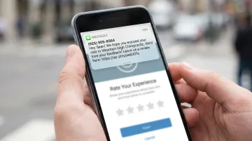 SMS review request message on smartphone screen after local service interaction