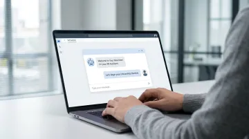 Employee onboarding chatbot conversation interface on laptop screen in office