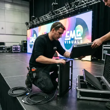 Technician setting up LED wall for event