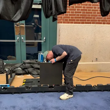Technician setting up LED trade show display