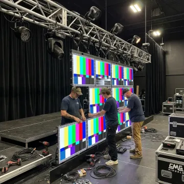 Technician assembling LED video wall panels