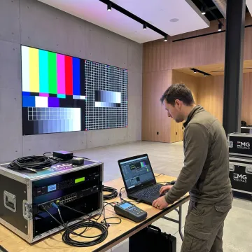 Technician calibrating a direct view LED video wall