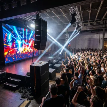 Giant LED screen displaying vivid visuals at an event