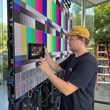 Technician servicing an LED video wall