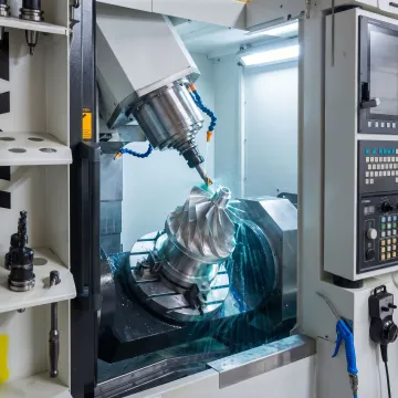 5-axis CNC milling machine machining a complex metal part