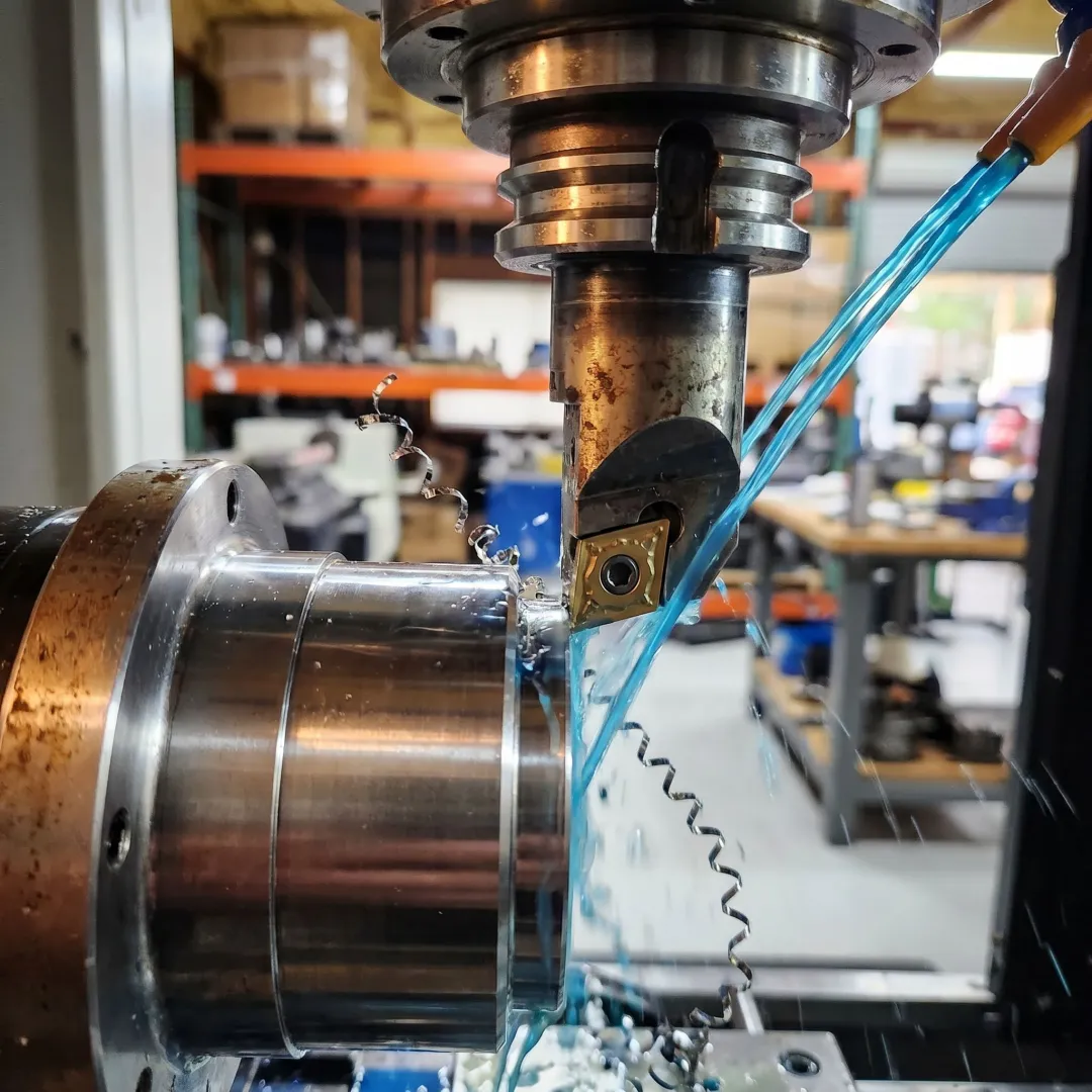 Precision machined metal component on CNC table