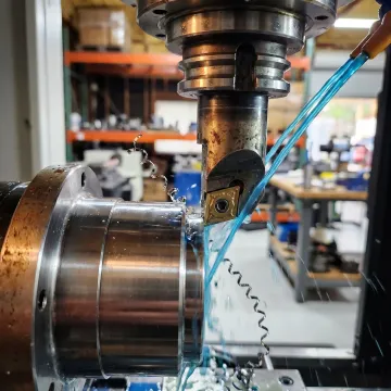 CNC machining center producing precision metal parts