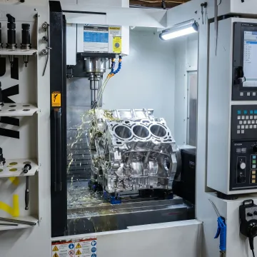 Custom CNC automotive prototype part being machined