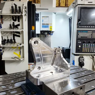 Machined aerospace component on CNC table