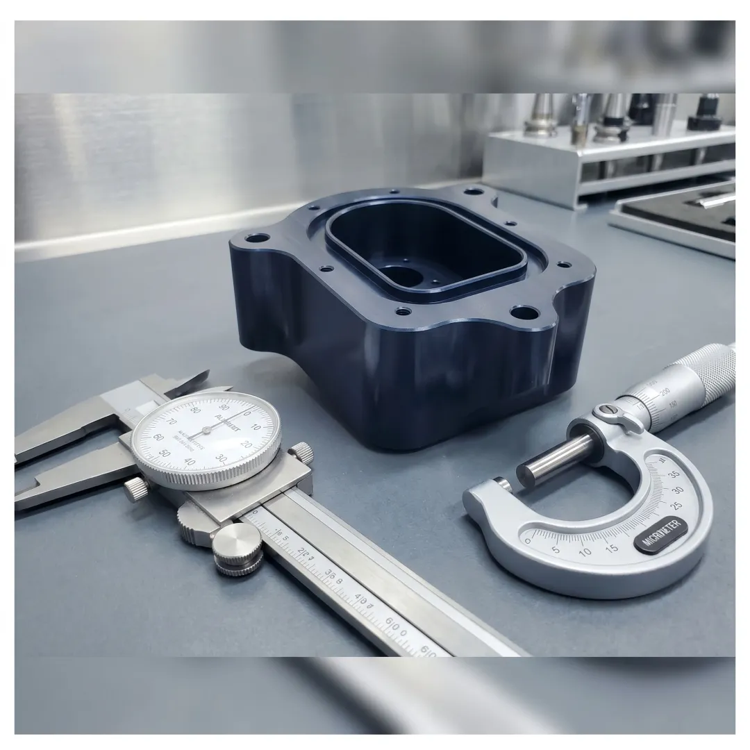 Precision machined metal parts on a workbench