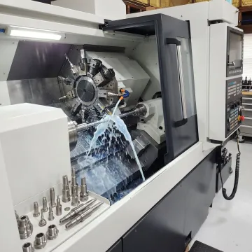 Swiss turning machine producing precision metal parts