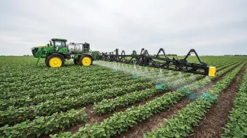 John Deere See and Spray precision herbicide system operating in crop field