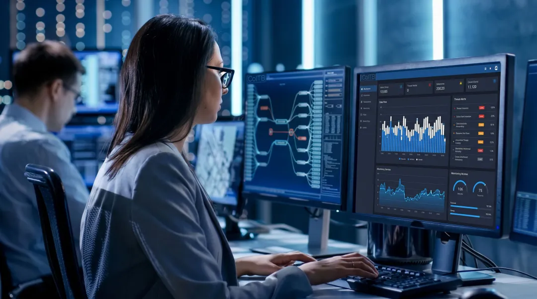 Cybersecurity analyst monitoring threat dashboard in enterprise security operations center