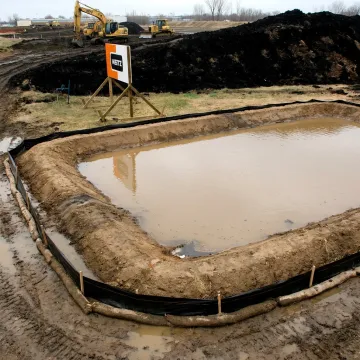 Temporary sediment basin at construction site