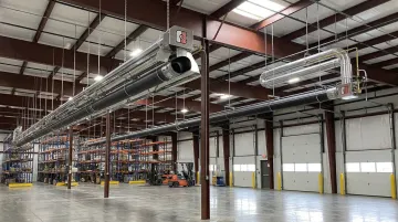 CRC low-intensity tube heater and high-intensity radiant heater ceiling-mounted in industrial facility