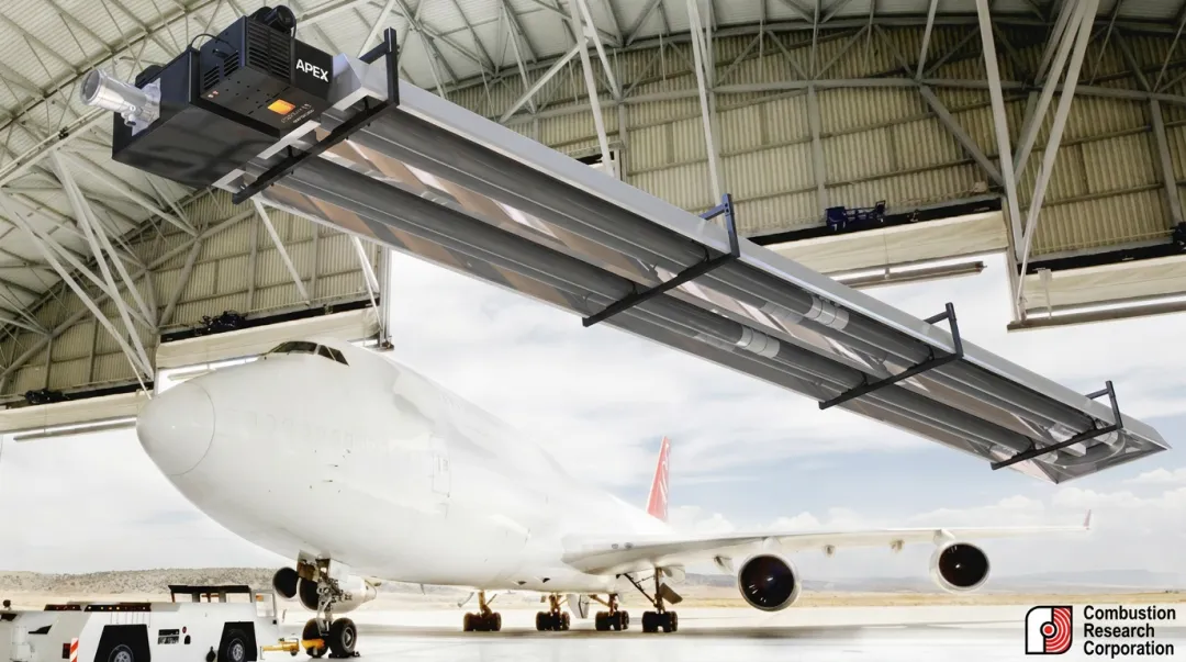 Ceiling-mounted infrared radiant tube heaters installed in large industrial aircraft hangar