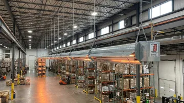 Combustion Research Corporation infrared tube heater installed in large industrial warehouse