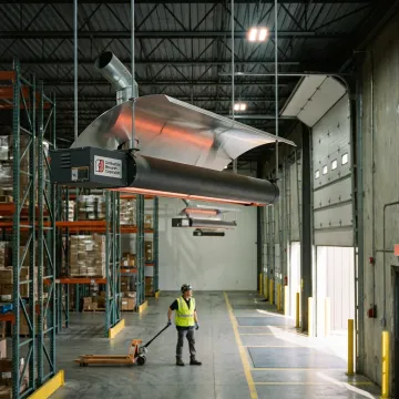 Gas infrared radiant tube heaters in a warehouse