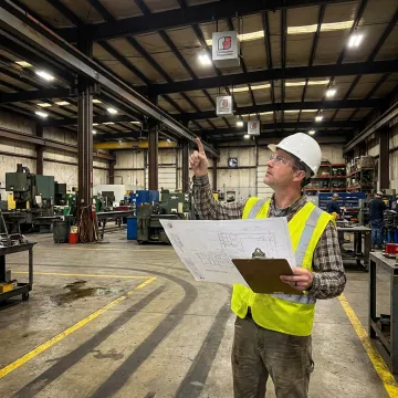 Engineer reviewing commercial infrared heating layout