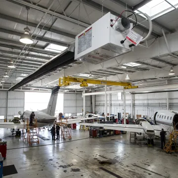 Radiant tube heaters installed in aircraft hangar