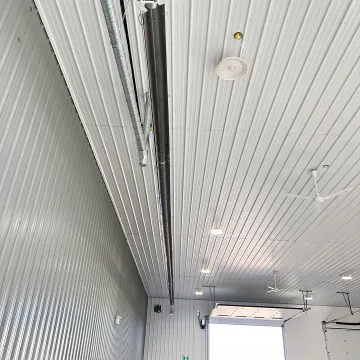 Engineer reviewing radiant heater plans for a church sanctuary