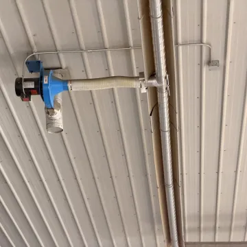 Engineer reviewing radiant tube heater plans