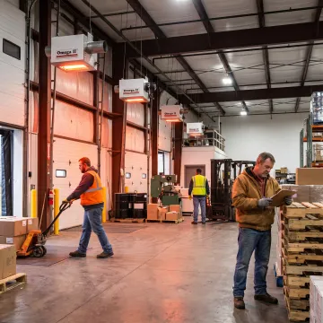 Radiant infrared heaters warming a commercial warehouse