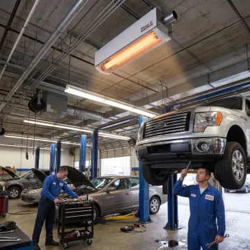Radiant tube heater warming an automotive shop