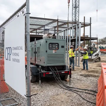 Construction generator powering an active jobsite