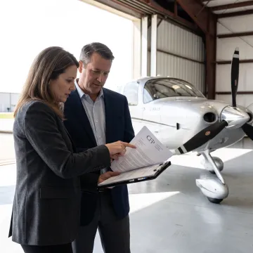 Business team reviewing aircraft financing