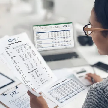 Finance professional reviewing equipment refinancing options