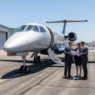 Business aircraft parked on an airport apron
