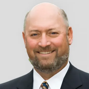 Portrait of Joseph R. Blattner, Founder of COMPackage