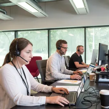 IT help desk team taking an online support training course