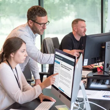 IT professionals completing online communication training