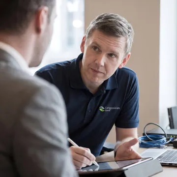 IT professional listening to a client