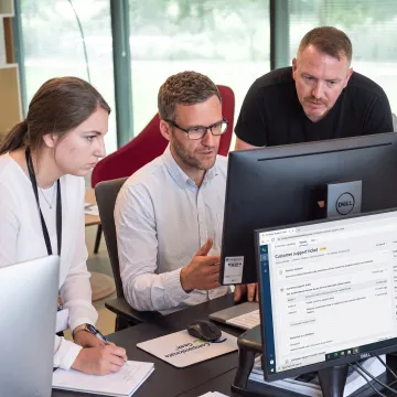 IT team collaborating on customer support