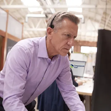 IT support professional assisting a customer by phone