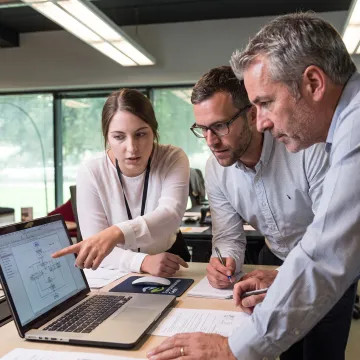 IT team discussing customer communication