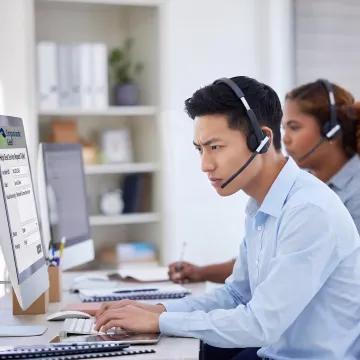 IT support professional listening attentively to a customer