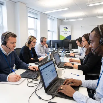 Support professionals practicing active listening during a customer conversation