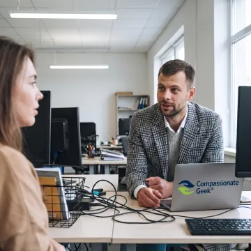 IT support professional listening attentively to a colleague
