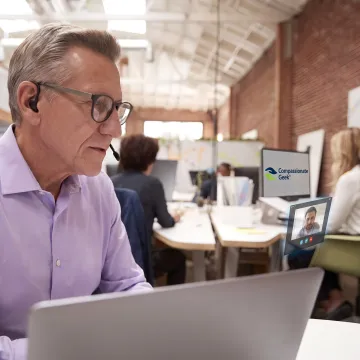 IT professional listening to a customer during support