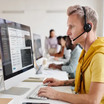 IT help desk professional assisting a customer