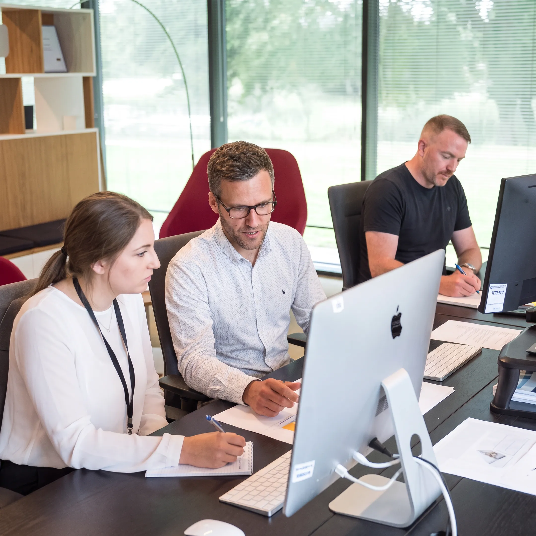 IT customer service team collaborating during a training session