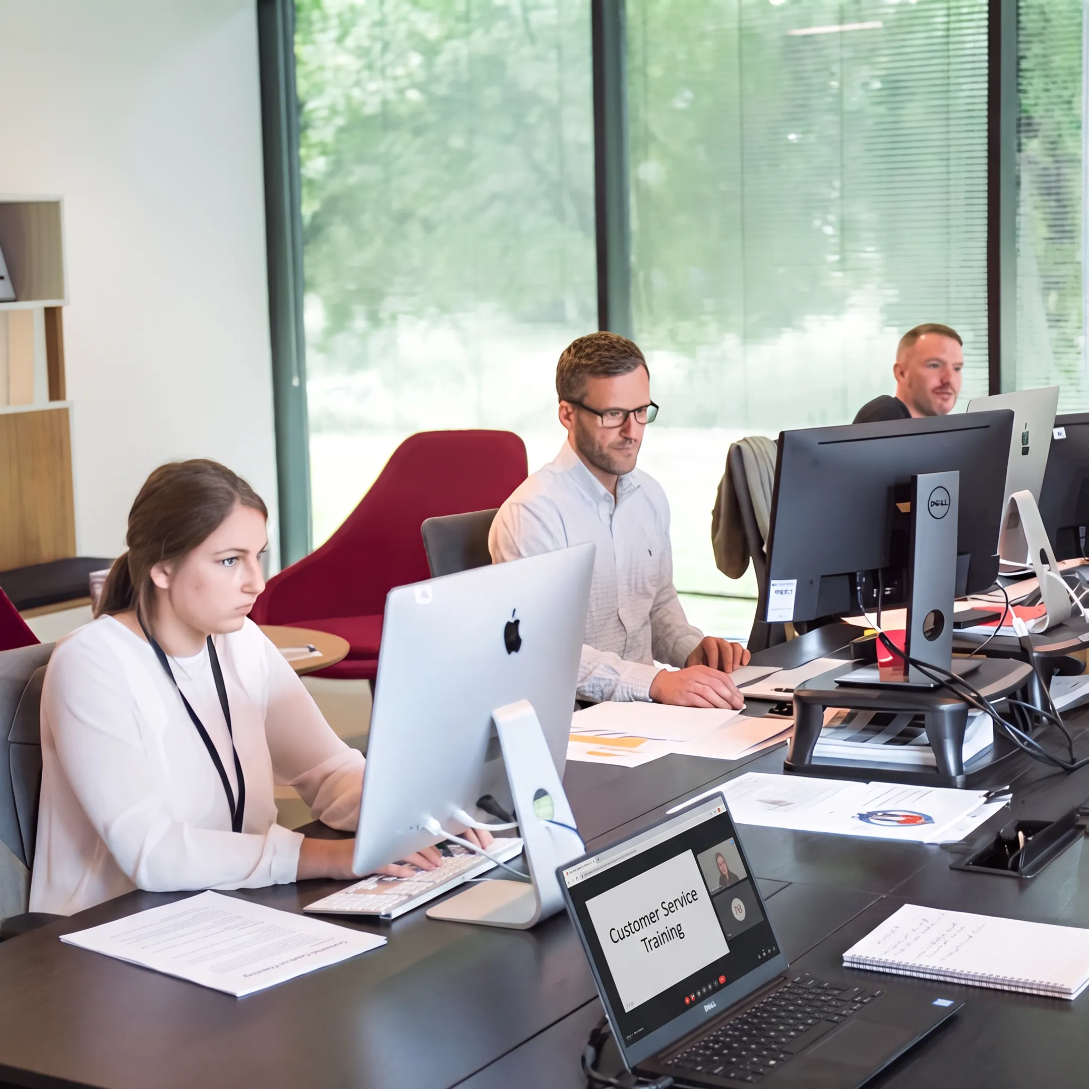 IT support team developing compassionate customer service skills during online training