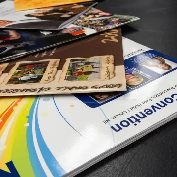 Laminated printed materials on a production table