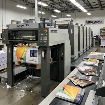 Commercial printing press producing marketing materials
