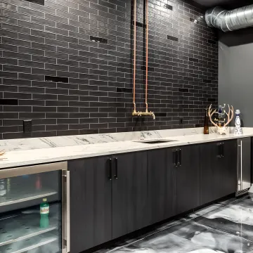 Designer reviewing plans for custom built-in wine cabinetry